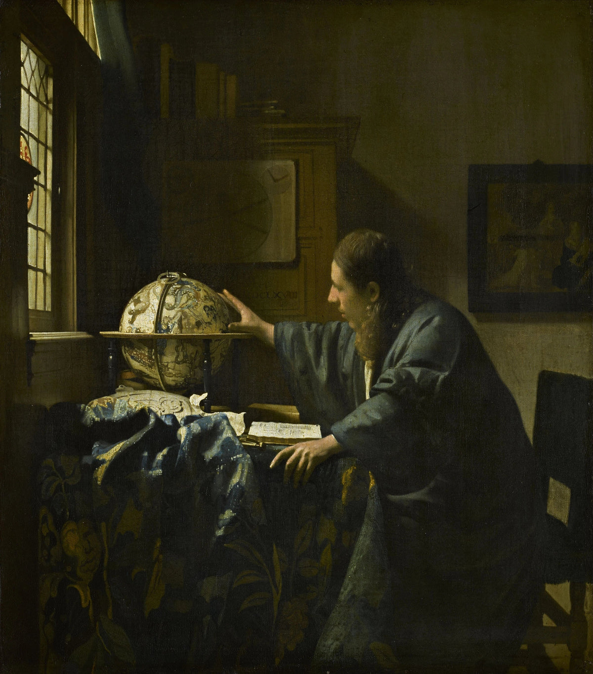 L’Astronome de Johannes Vermeer, savant penché vers un globe céleste